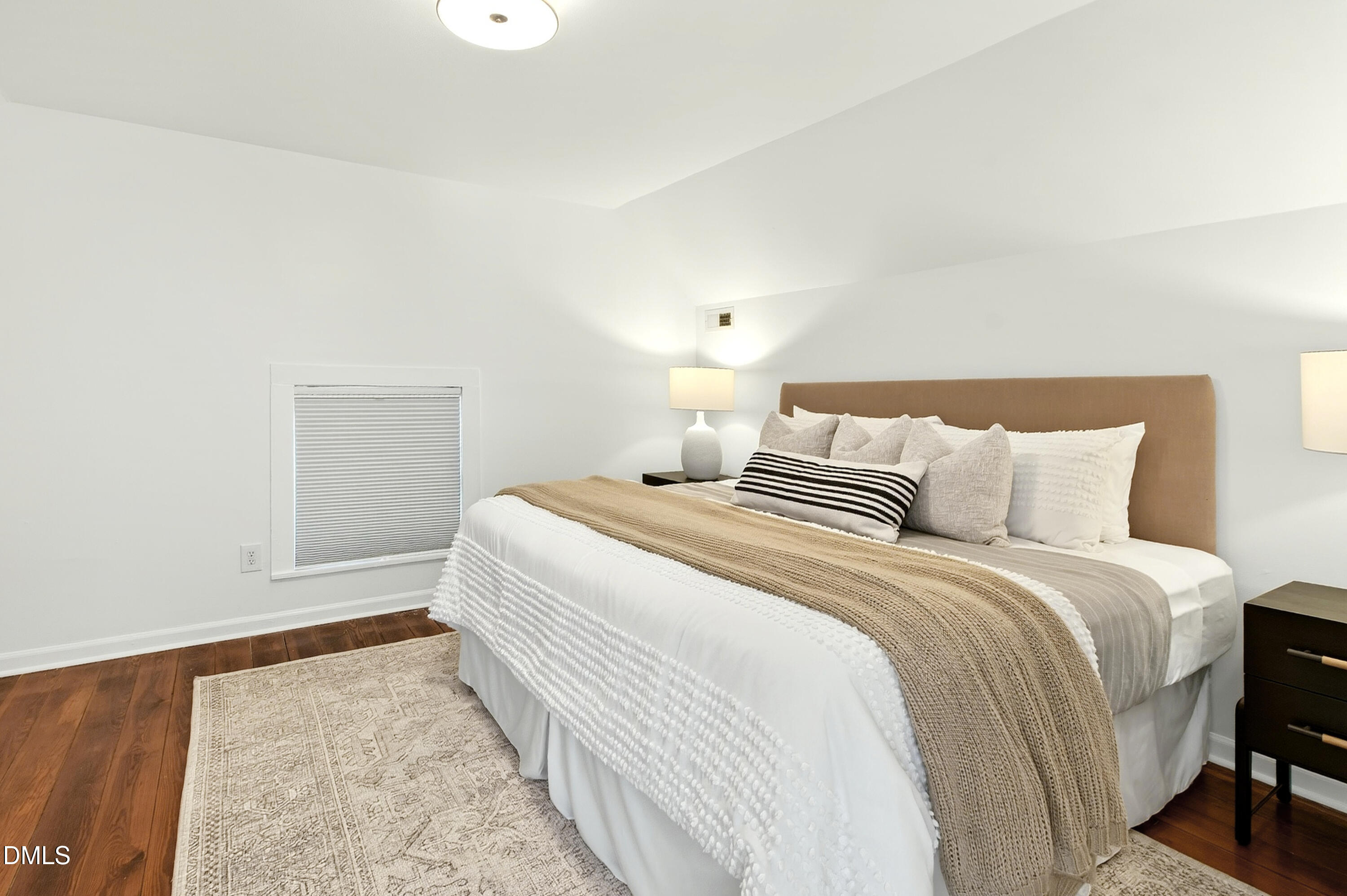 913 Washington Street Durham, NC 27701 - Photo 21 of 37 a bedroom with a bed and a night stand