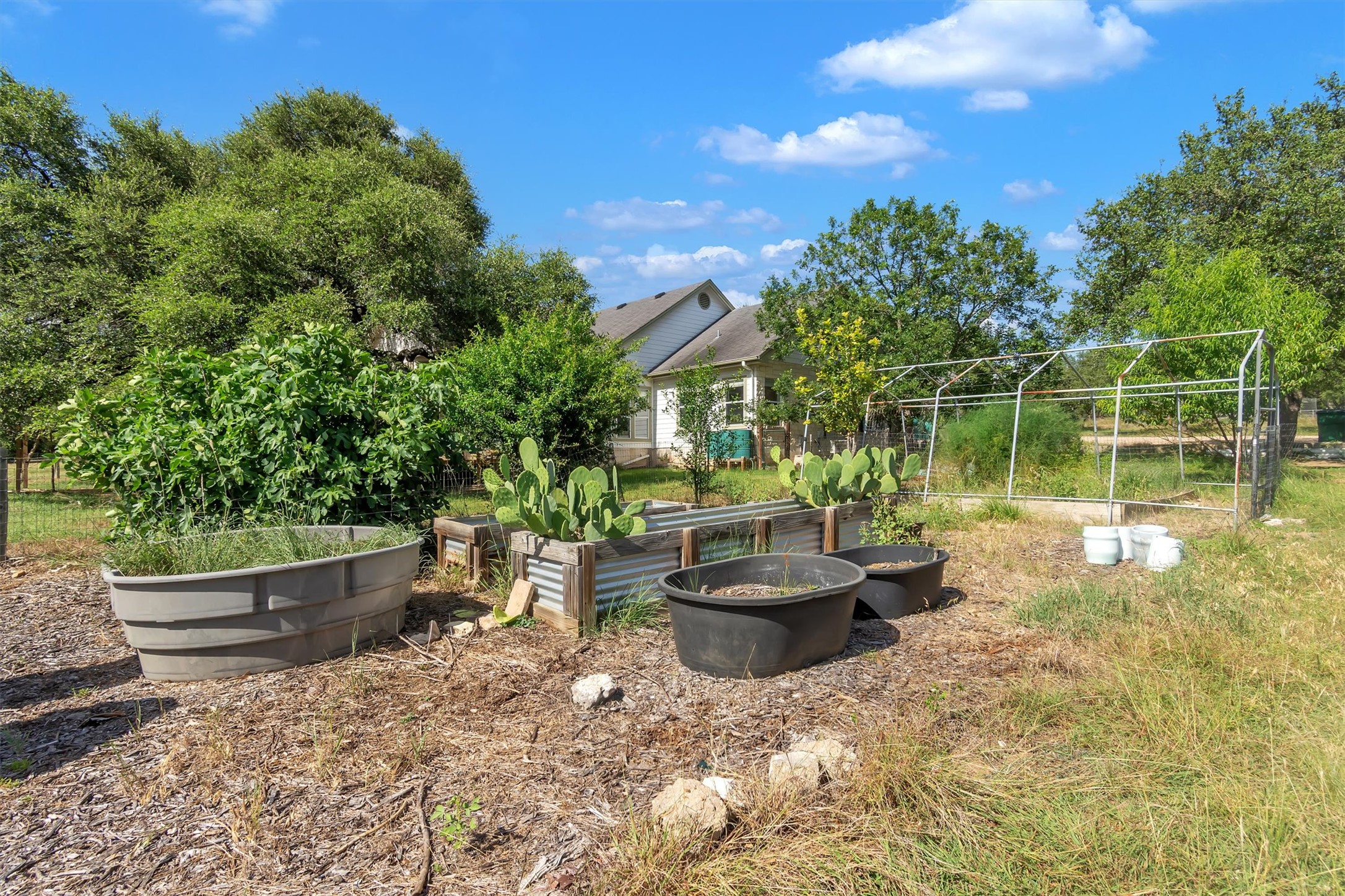 1120 Meadow Ridge Drive Austin, TX 78737 - Photo 32 of 40 Cultivate your own haven with a dedicated garden space and ample room for green endeavors.