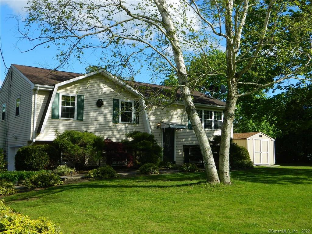 39 Caribou Dr with mature trees and plantings