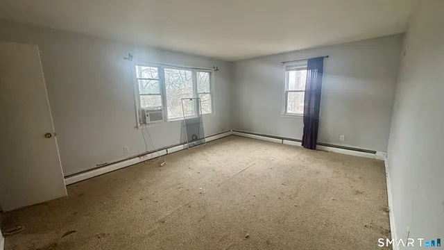 a kitchen with stainless steel appliances a refrigerator sink and cabinets