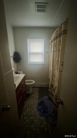 a bed room with furniture and a window