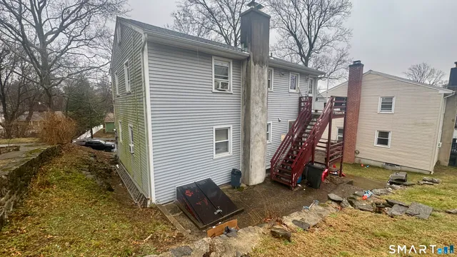 a view of a house with a snow on the road