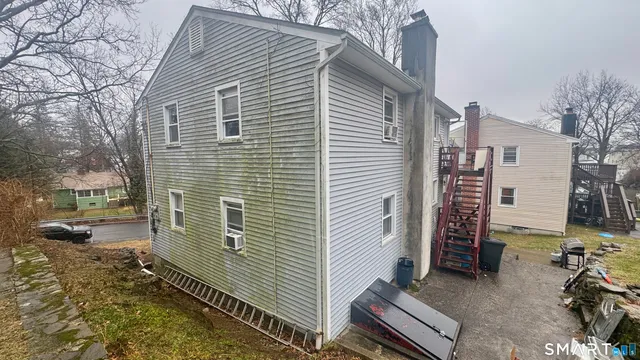 a view of a house with a yard and garage
