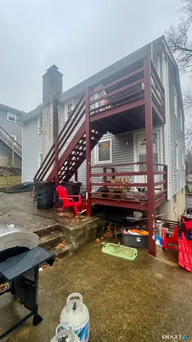 a room with pool table and a chandelier