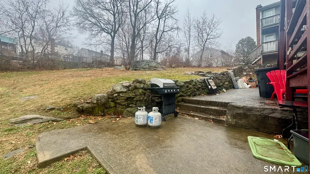 a view of a water fountain and a yard