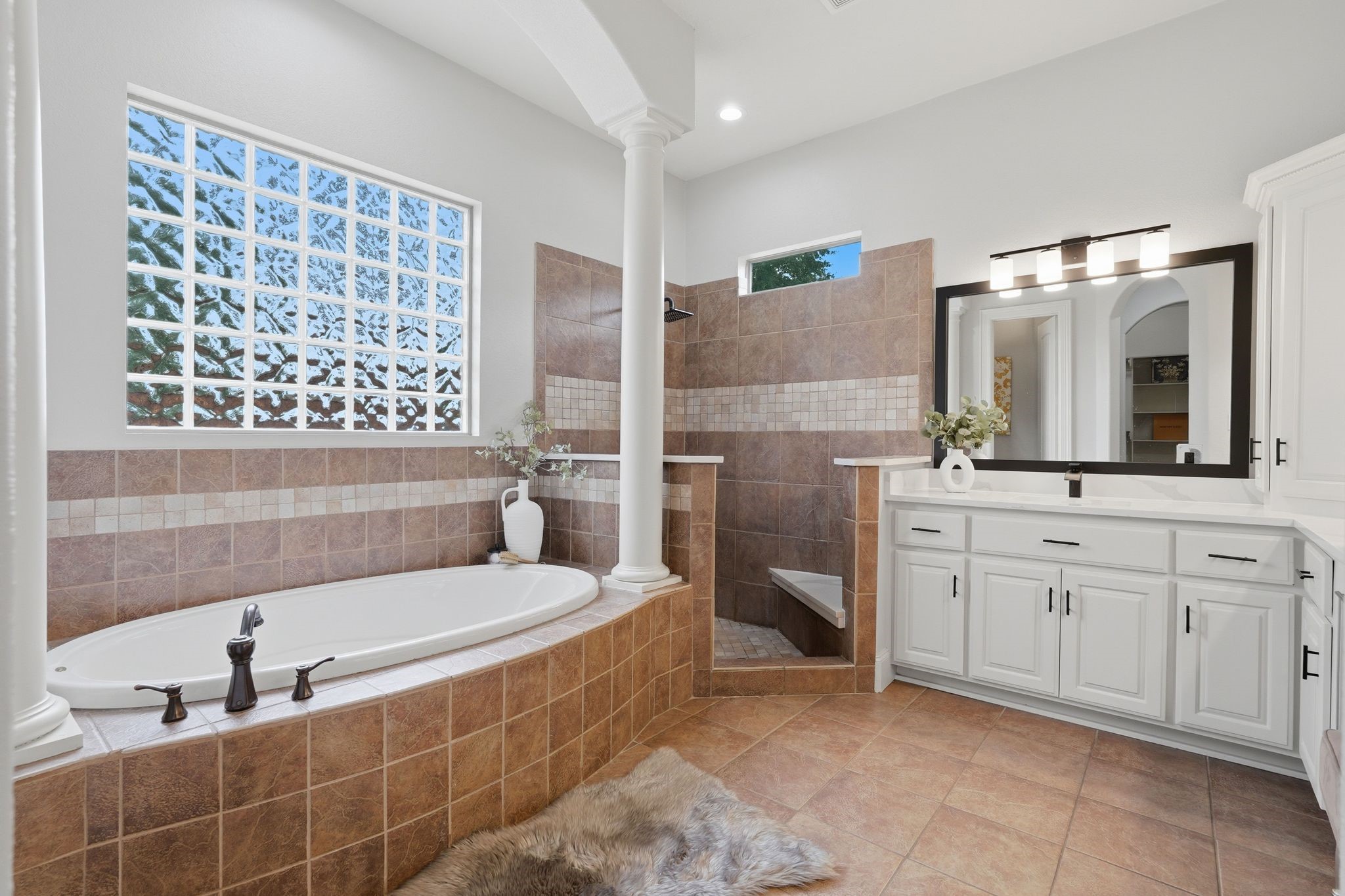 7603 Hogan Bridge Court Spring, TX 77389 - Photo 20 of 50 Unwind in the primary bath complete with a jetted tub and generously sized shower