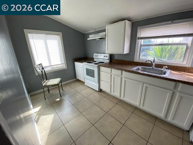 809 West 2nd Street Antioch, CA 94509 - Photo 2 of 23 a kitchen with a sink cabinets and window