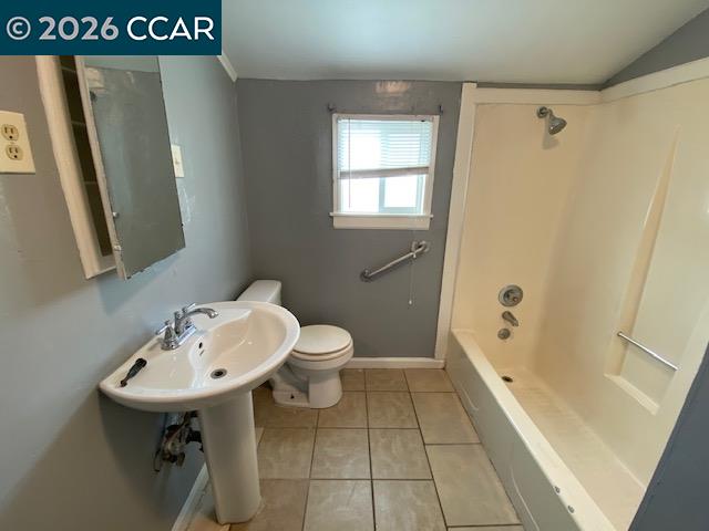 809 West 2nd Street Antioch, CA 94509 - Photo 3 of 23 a bathroom with a sink a toilet and shower