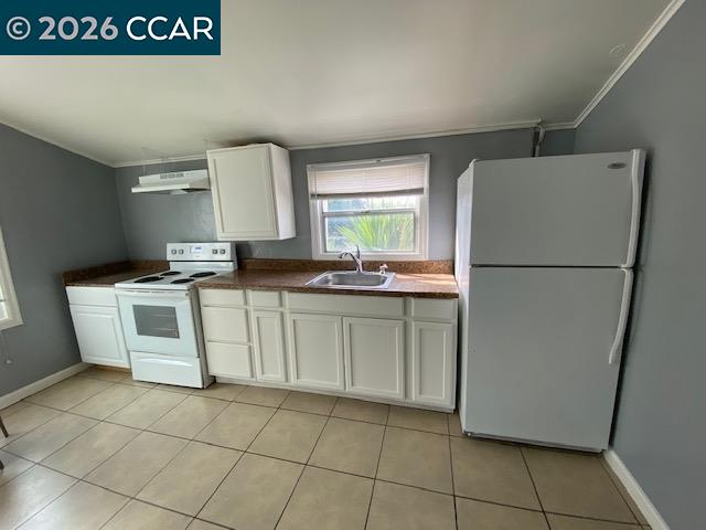 809 West 2nd Street Antioch, CA 94509 - Photo 6 of 23 a kitchen with a sink a stove and refrigerator