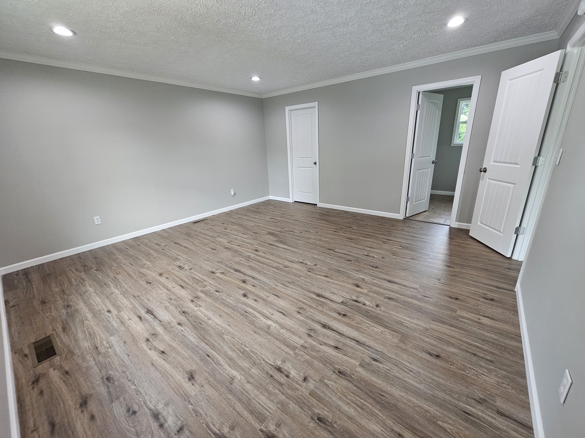 362 Forest Point Road Monteagle, TN 37356 - Photo 29 of 42 an empty room with wooden floor and entrance
