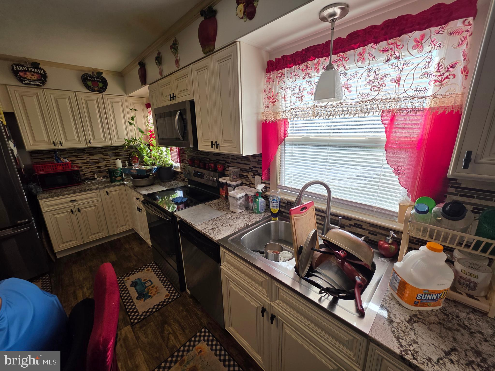 44 Springvale Road Red Lion, PA 17356 - Photo 27 of 29 a kitchen with a sink stove and cabinets
