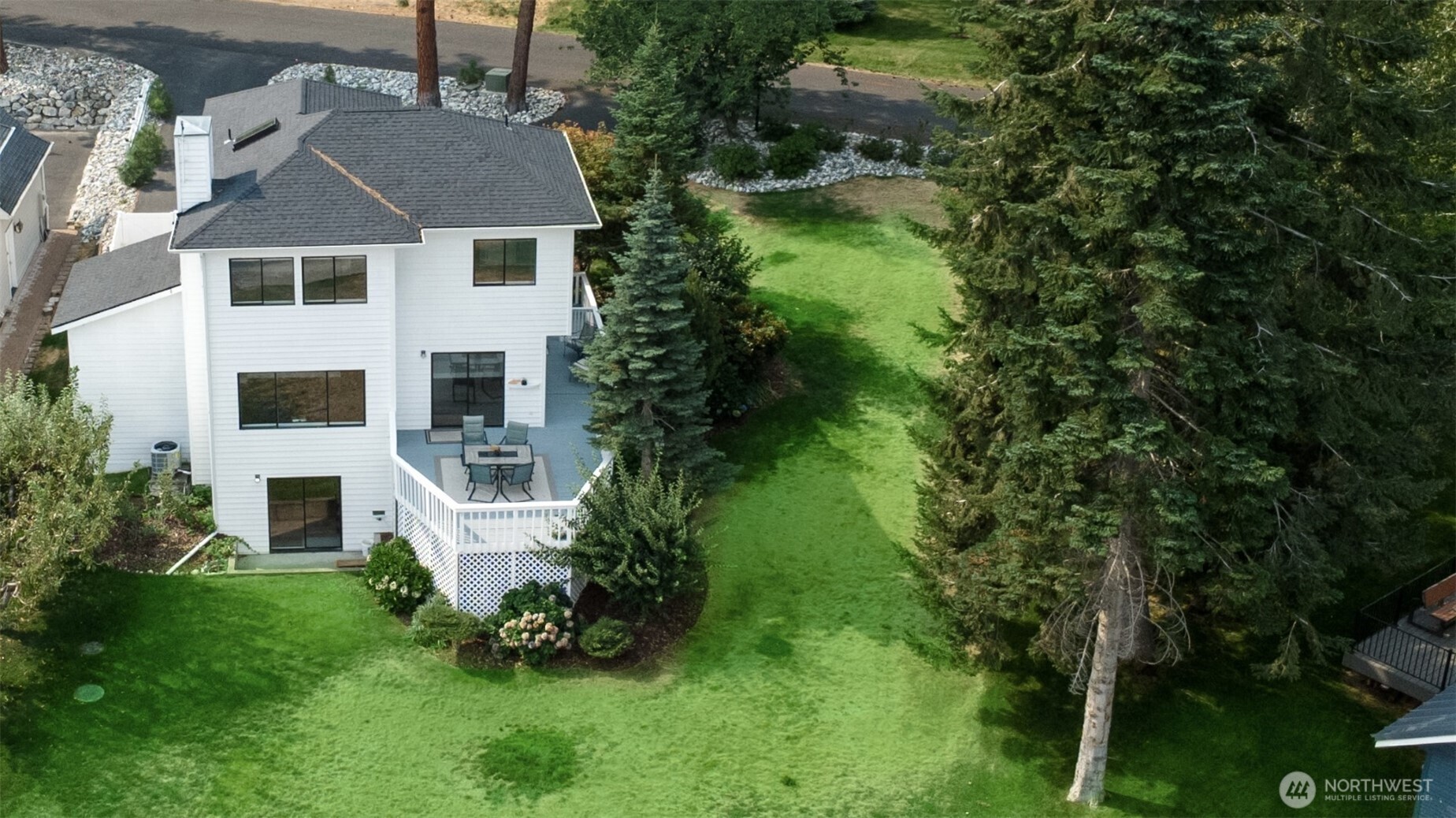 4124 Lakeview Place Chelan, WA 98816 - Photo 2 of 40 a aerial view of a house with a yard table and chairs