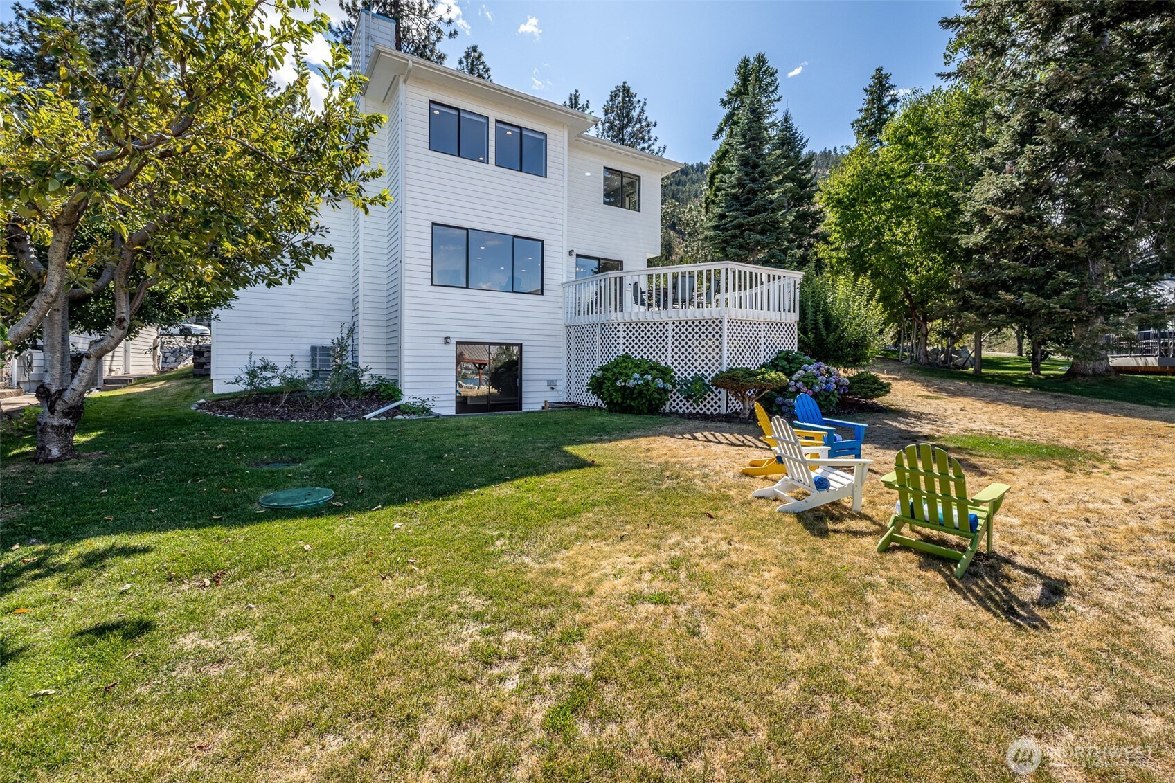 4124 Lakeview Place Chelan, WA 98816 - Photo 39 of 40 a view of a house with backyard and sitting area