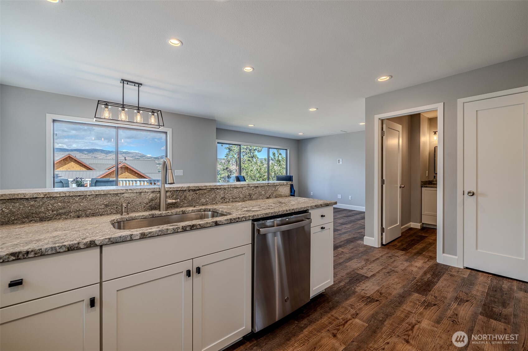 4124 Lakeview Place Chelan, WA 98816 - Photo 9 of 40 a kitchen with a sink cabinets and wooden floor