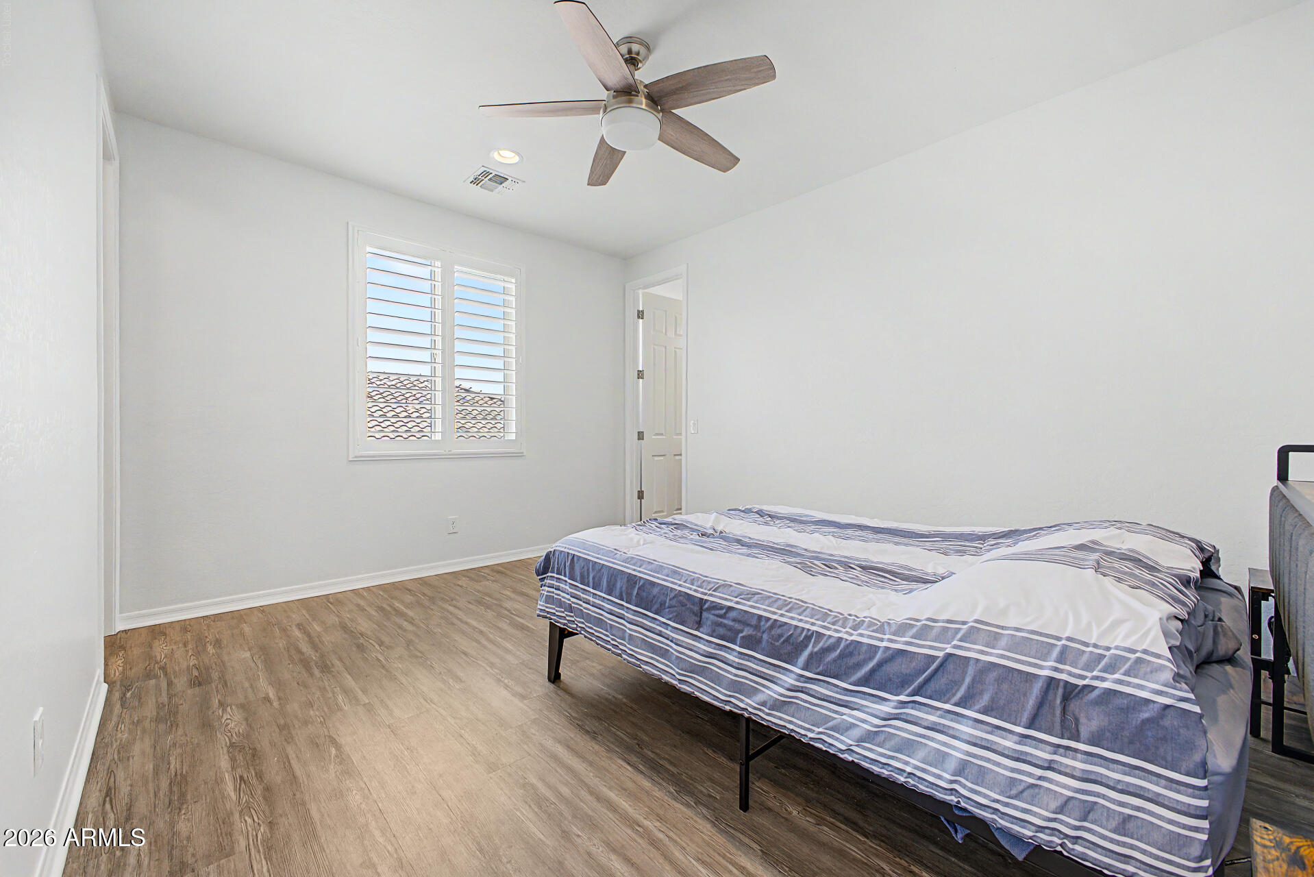 1076 East Kensington Road Gilbert, AZ 85297 - Photo 26 of 73 a bedroom with a bed and a window