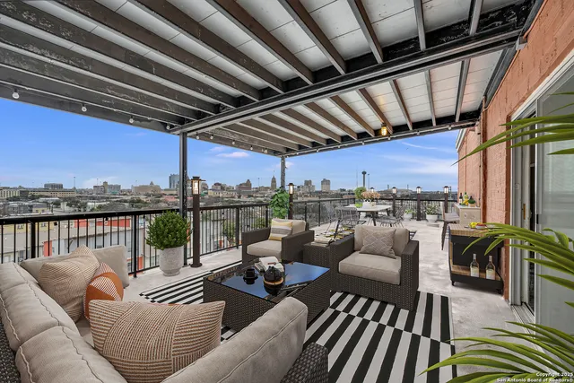 a balcony with furniture and outdoor view