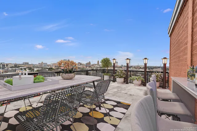 a view of a terrace with furniture