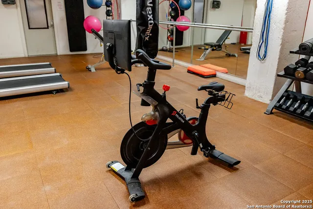 a view of a room with gym equipment