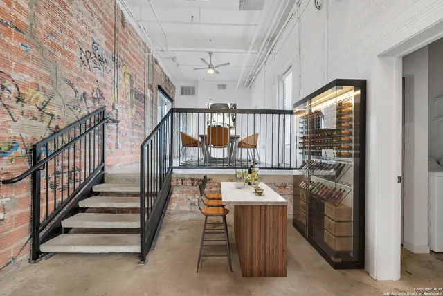 a room with lots of furniture and window