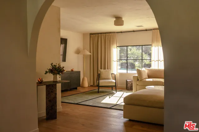 a living room with furniture and a window