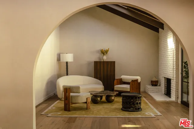 a front view of a house with sitting area