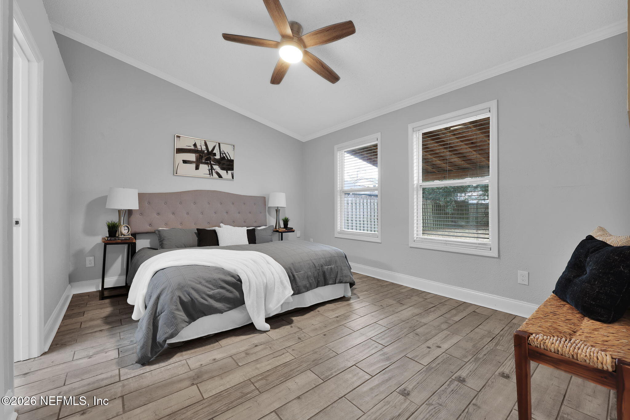 2494 Spring Vale Road Jacksonville, FL 32246 - Photo 18 of 36 a spacious bedroom with a bed and window