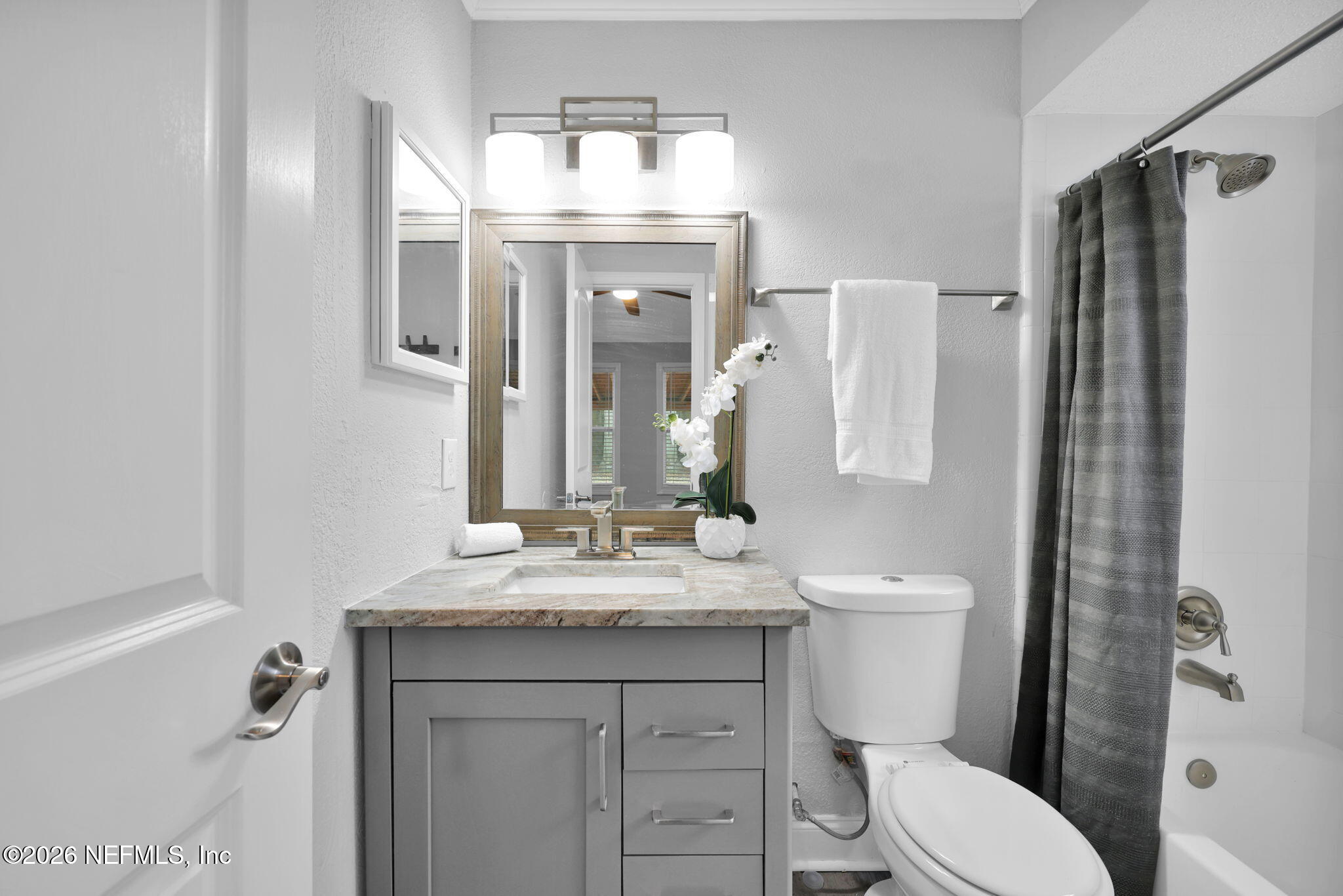 2494 Spring Vale Road Jacksonville, FL 32246 - Photo 24 of 36 a bathroom with a granite countertop toilet sink and mirror