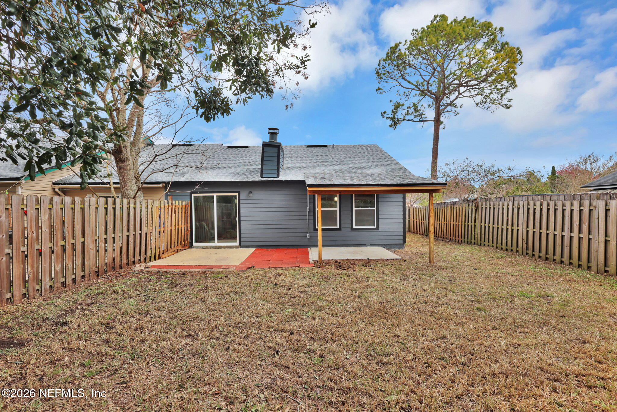 2494 Spring Vale Road Jacksonville, FL 32246 - Photo 34 of 36 a front view of a house with a yard and garage