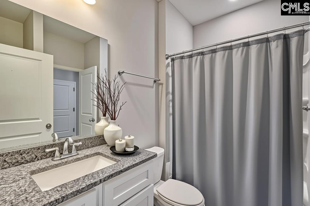 265 Eastover Road Eastover, SC 29044 - Photo 9 of 15 a bathroom with a granite countertop sink and a mirror