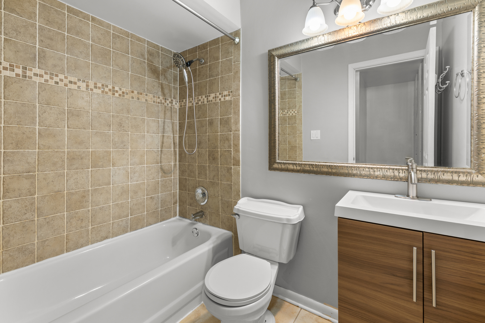 146 Inverrary Lane, Unit 146 Deerfield, IL 60015 - Photo 11 of 19 a bathroom with a sink a toilet and shower