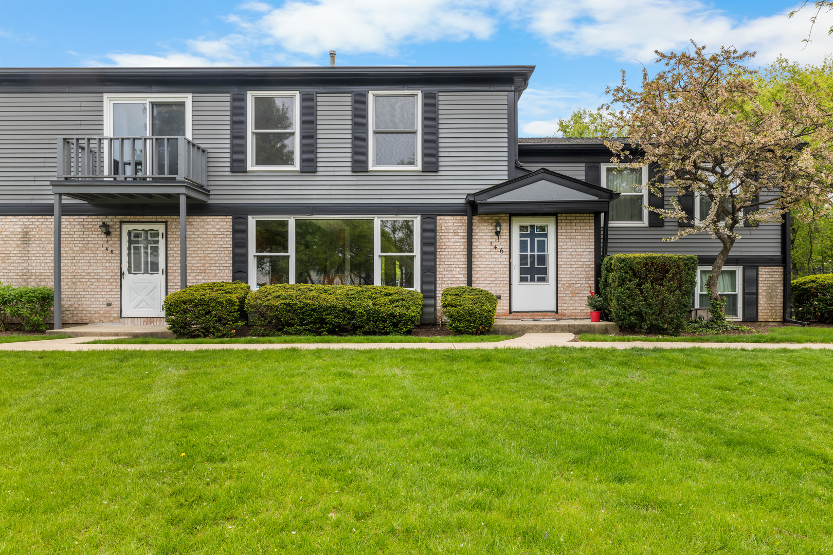 146 Inverrary Lane, Unit 146 Deerfield, IL 60015 - Photo 2 of 19 a front view of a house with garden
