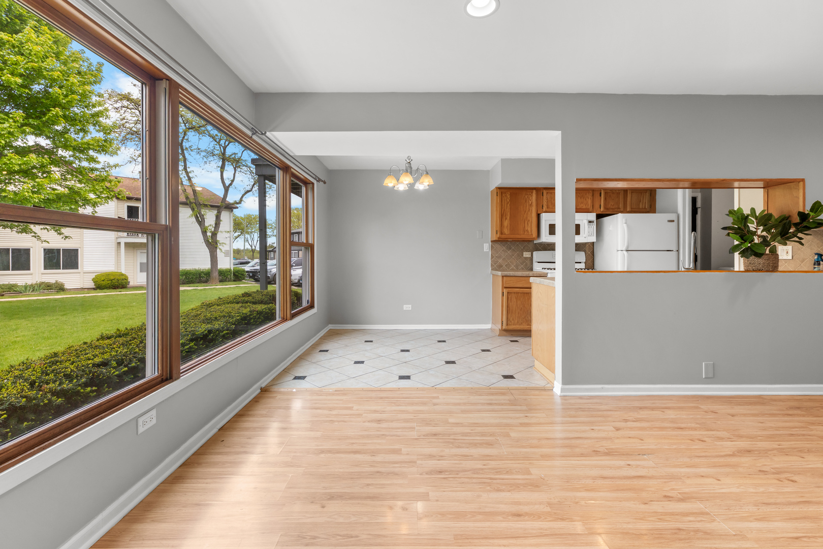 146 Inverrary Lane, Unit 146 Deerfield, IL 60015 - Photo 6 of 19 a view of kitchen with wooden floor and a large window