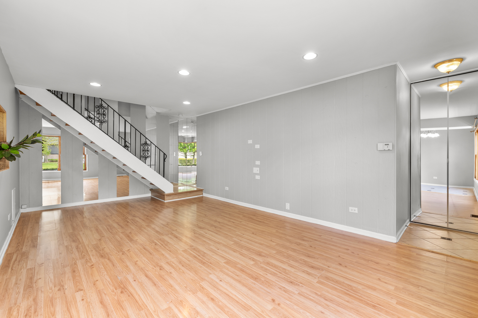 146 Inverrary Lane, Unit 146 Deerfield, IL 60015 - Photo 8 of 19 a view of an empty room with wooden floor