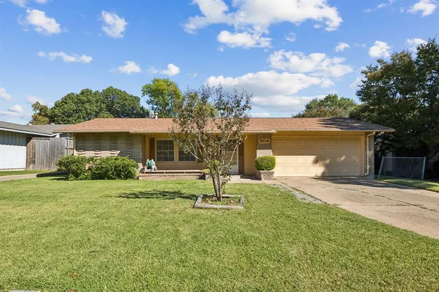 a house view with a garden space
