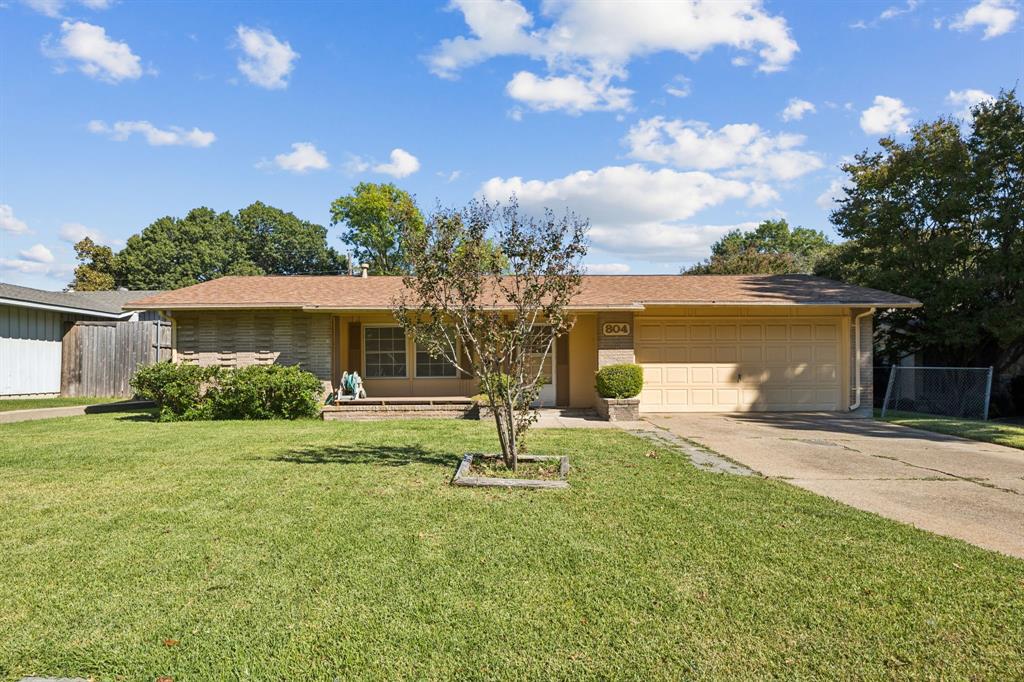 a house view with a garden space