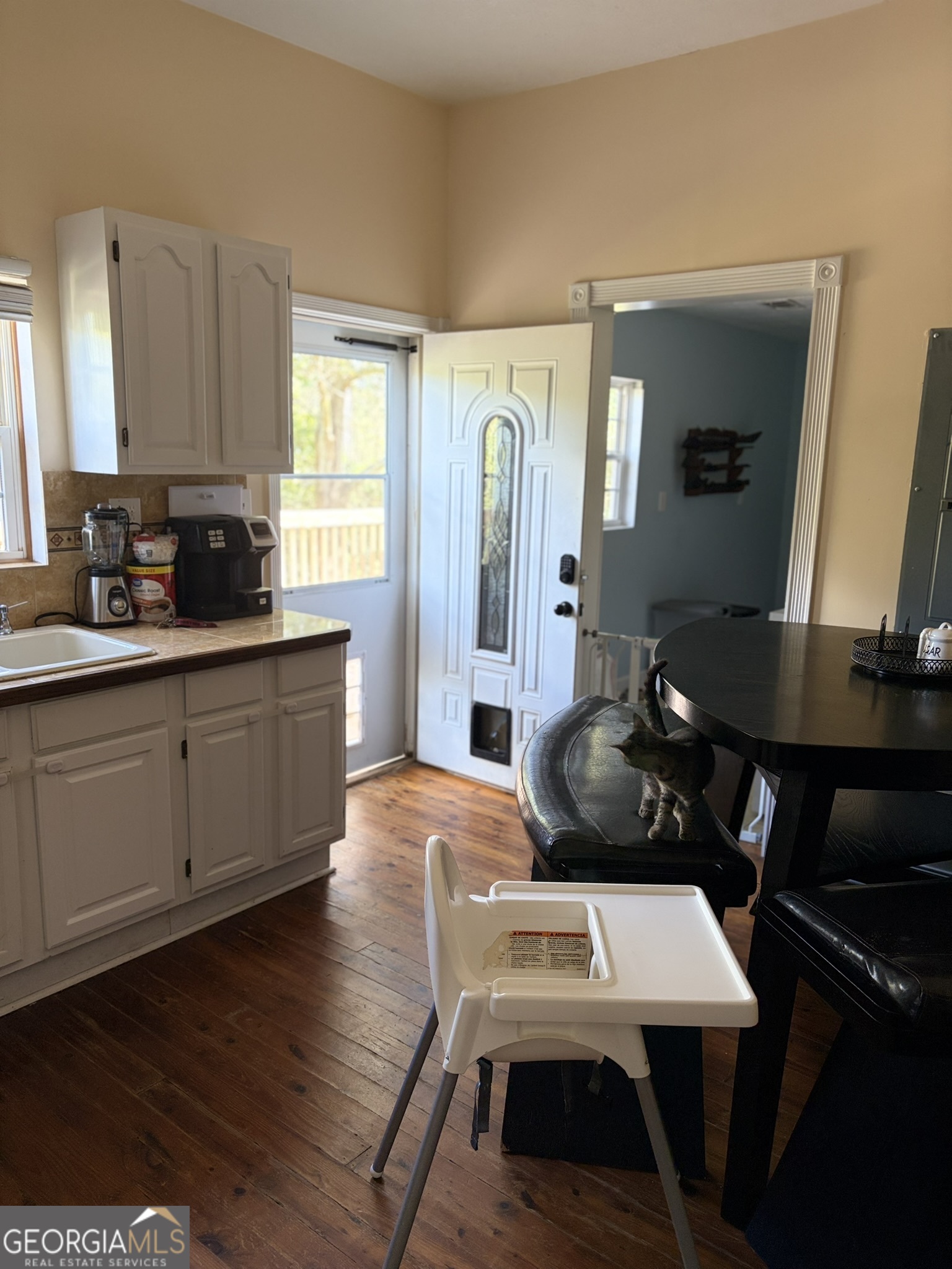 80 Baugh Street Commerce, GA 30529 - Photo 12 of 31 a living room with furniture and a wooden floor