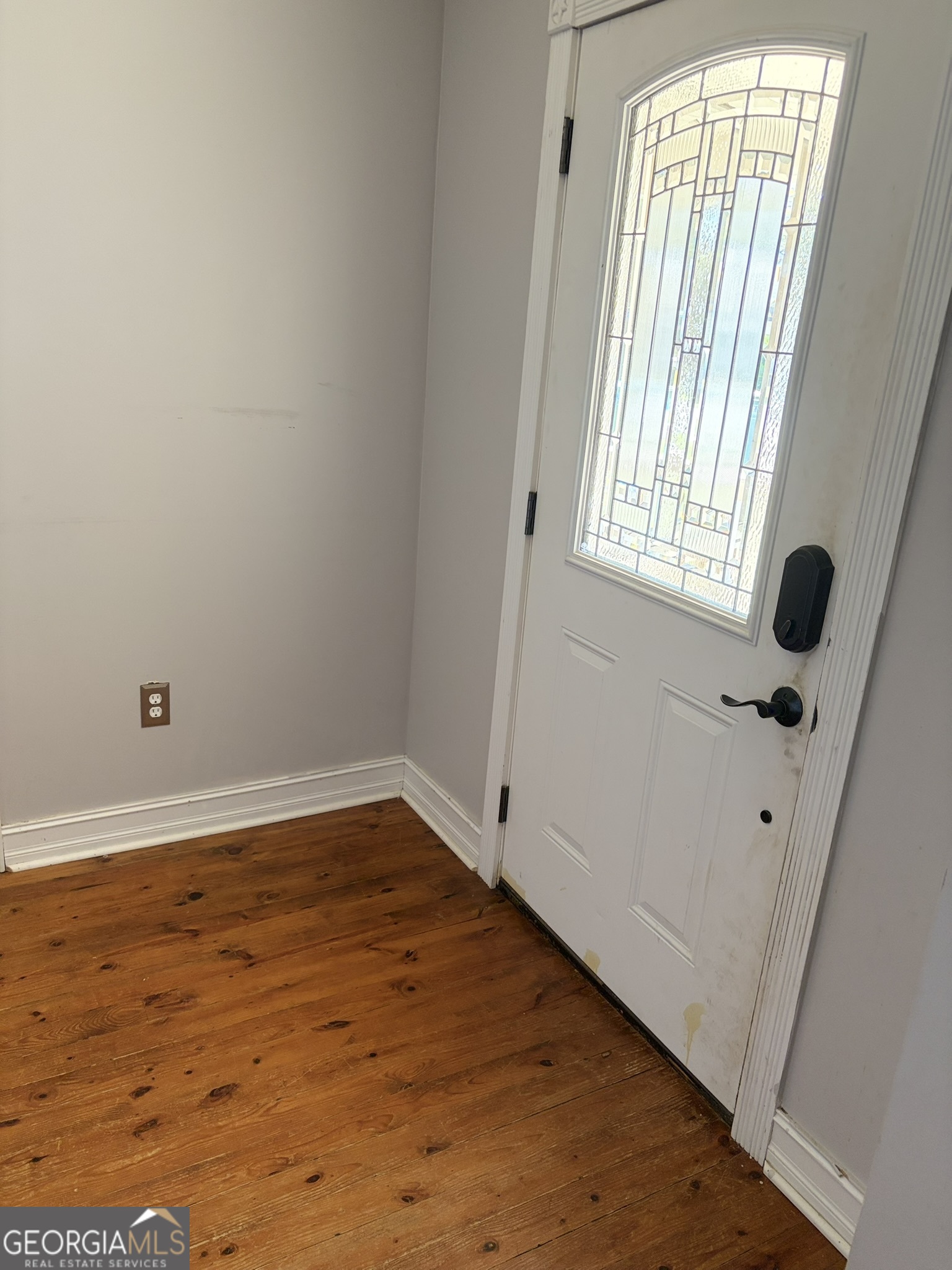 80 Baugh Street Commerce, GA 30529 - Photo 20 of 31 wooden floor in an empty room with a window