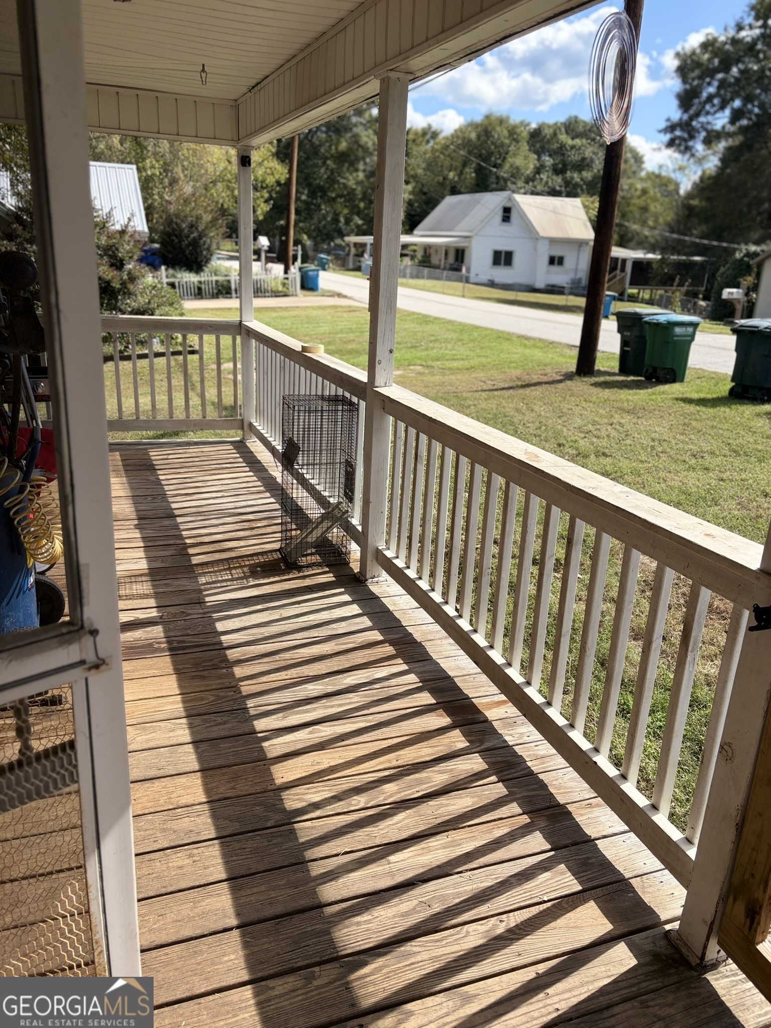 80 Baugh Street Commerce, GA 30529 - Photo 3 of 31 a view of a balcony with wooden floor