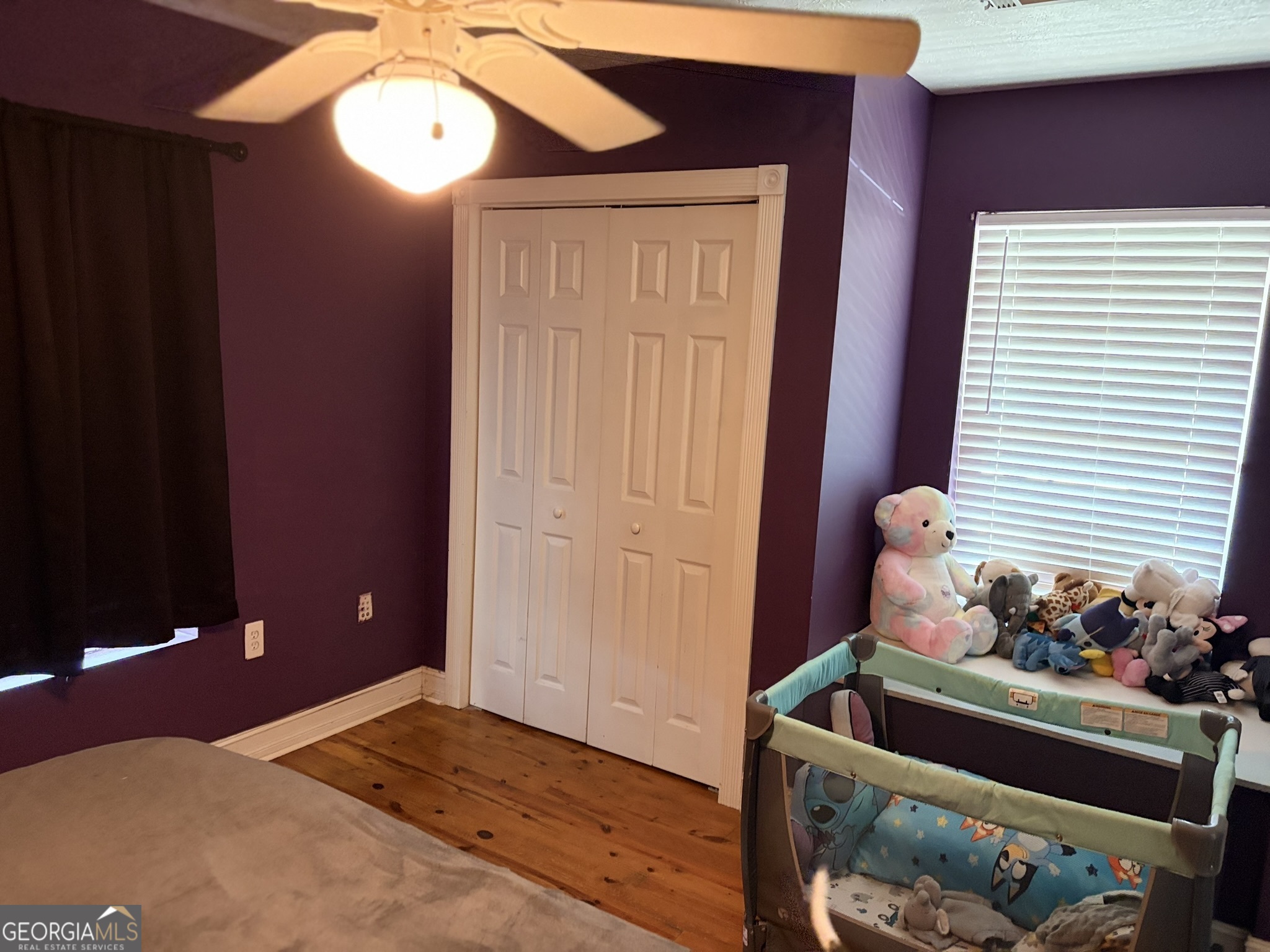 80 Baugh Street Commerce, GA 30529 - Photo 5 of 31 a bed room with a bed and a window