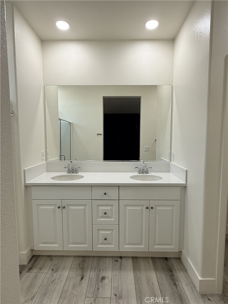 4067 Summer Corona, CA 92883 - Photo 12 of 12 Primary bathroom featuring dual-sink vanity, ample storage, and contemporary finishes.