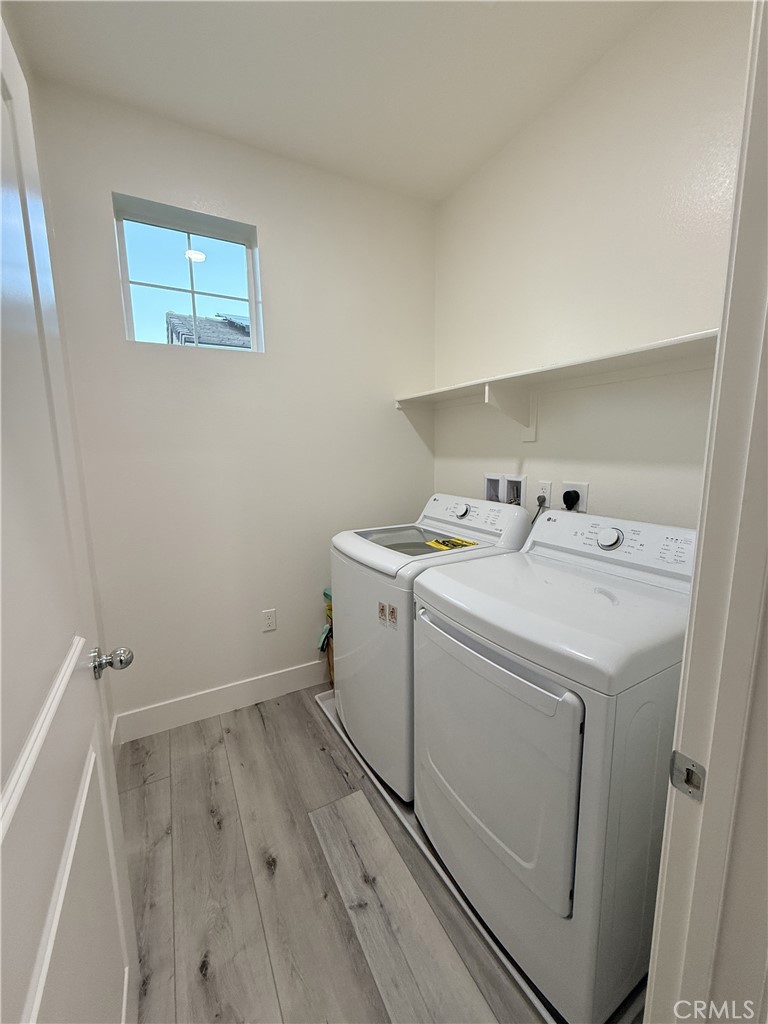 4067 Summer Corona, CA 92883 - Photo 8 of 12 Dedicated laundry room with shelving and washer/dryer hookups.