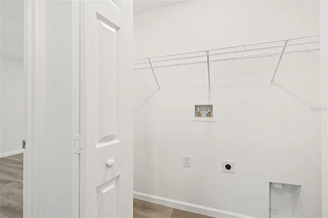 a view of a house with pool and a yard