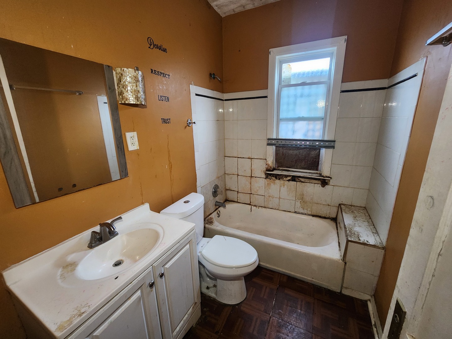 18 West 114th Street Chicago, IL 60628 - Photo 11 of 14 a bathroom with a sink a toilet and shower
