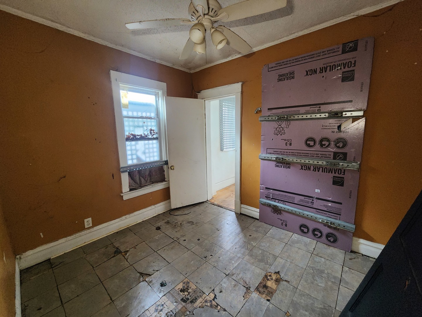 18 West 114th Street Chicago, IL 60628 - Photo 12 of 14 a view of an empty room with a window