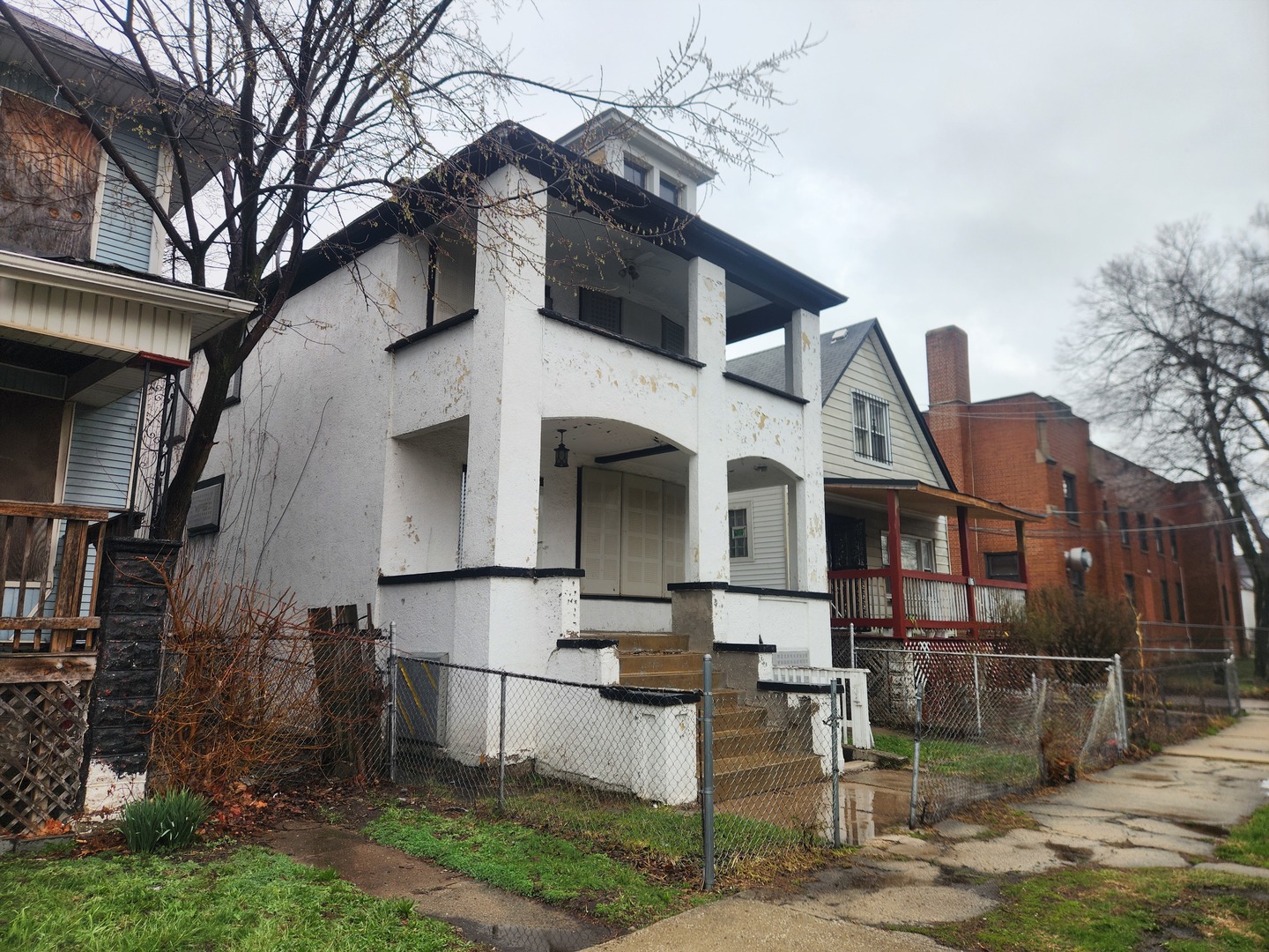 18 West 114th Street Chicago, IL 60628 - Photo 2 of 14 a front view of a house with yard