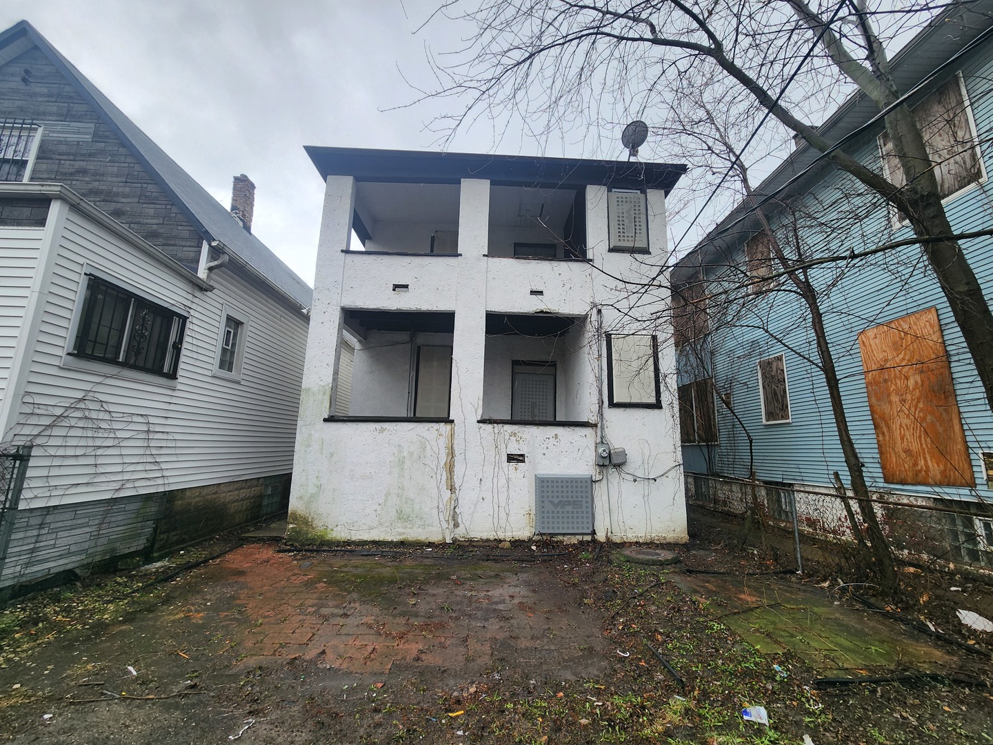 18 West 114th Street Chicago, IL 60628 - Photo 3 of 14 a view of a white house with large windows