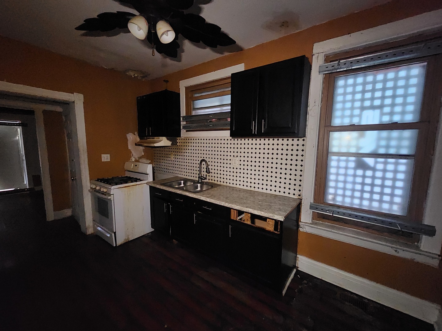 18 West 114th Street Chicago, IL 60628 - Photo 7 of 14 a kitchen with a stove and a microwave