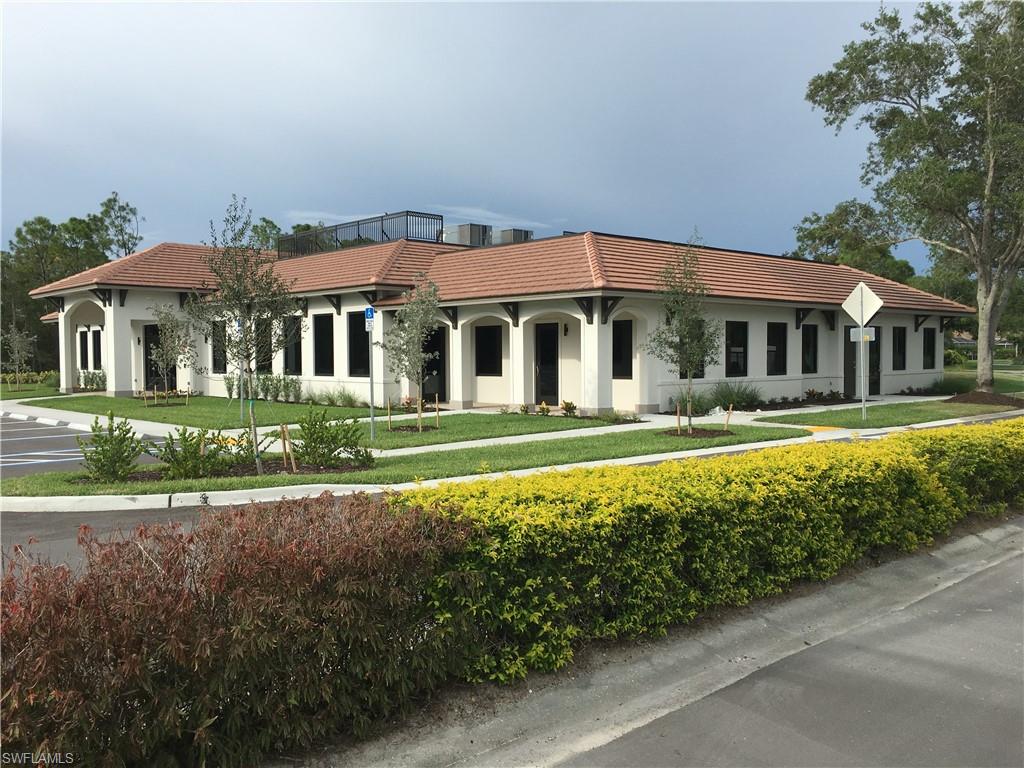 Undisclosed Address Naples, FL 34112 - Photo 16 of 28 a front view of a house with a yard
