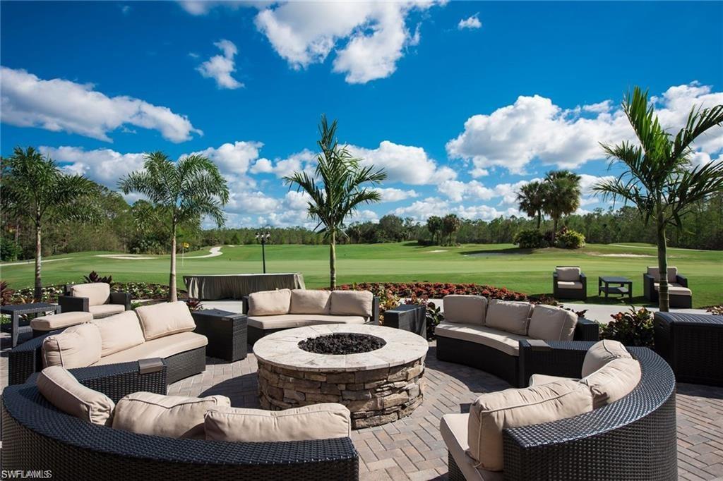 Undisclosed Address Naples, FL 34112 - Photo 19 of 28 a view of a patio with couches potted plants and a big swimming pool