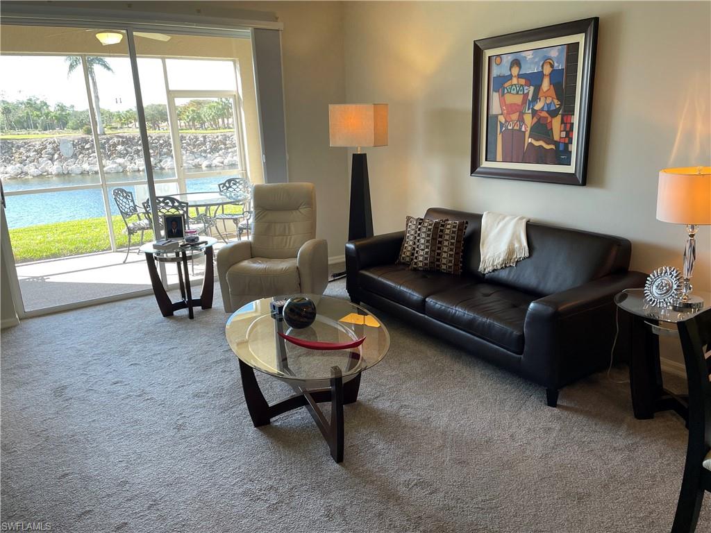 Undisclosed Address Naples, FL 34112 - Photo 5 of 28 a living room with furniture and a large window